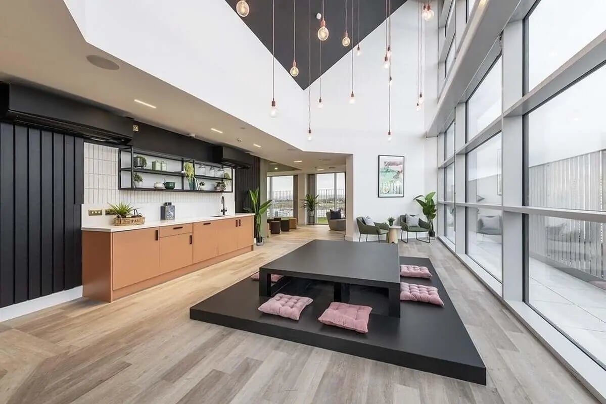 Kitchen and low table with cushions living area at Bridle Works Glasgow in Glasgow Student Accommodation