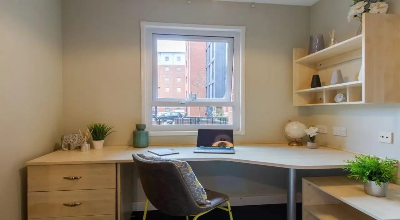 Desk chair laptop globe and plants study area at Brayford Quay in Lincoln Student Accommodation