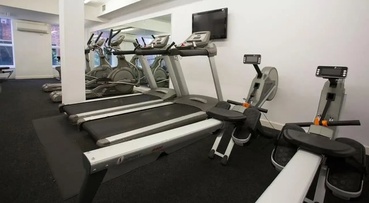 Gym with treadmills rowing machines and TV at Brayford Quay in Lincoln Student Accommodation