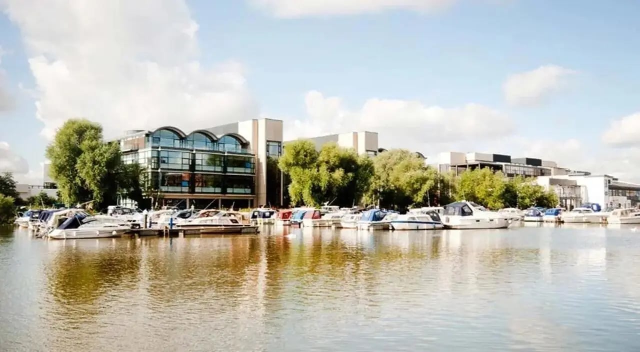 Boats docked by modern buildings exterior at Brayford Quay in Lincoln Student Accommodation
