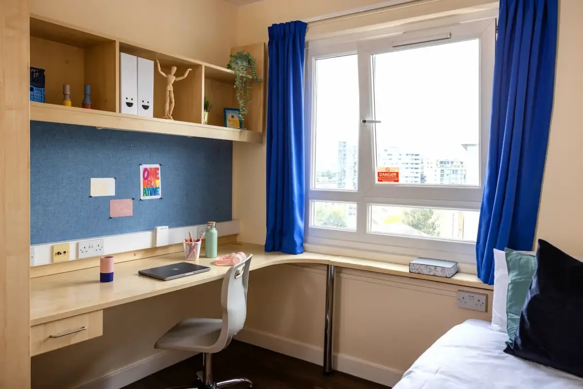 Desk laptop chair and shelves study area at Mcmillan student Village in Greenwich Student Accommodation