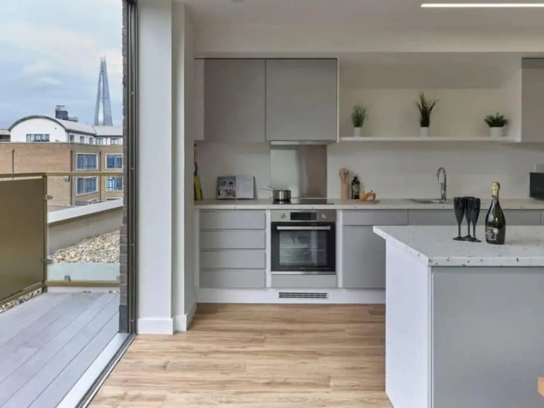 Modern grey kitchen with island and city view kitchen at View Studios in London Student Accommodation
