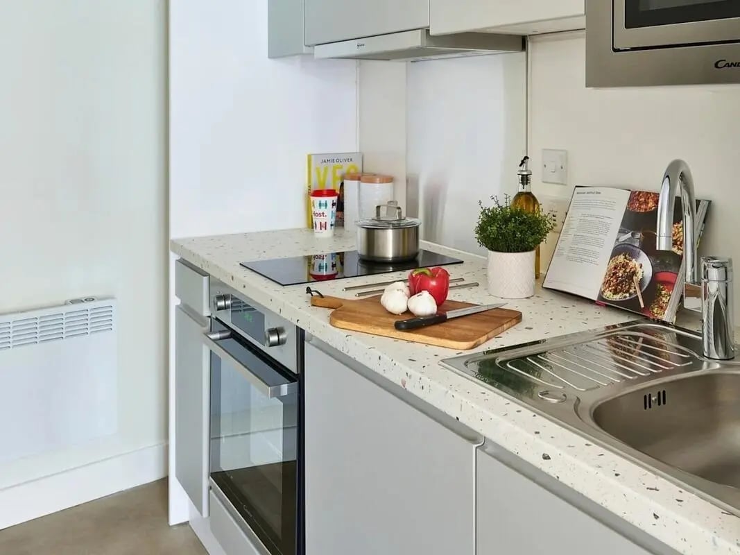 Countertop with ingredients oven and sink kitchen at View Studios in London Student Accommodation
