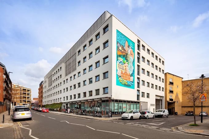 Modern white building with mural exterior at The Stay Club - Kentish Town in London Student Accommodation