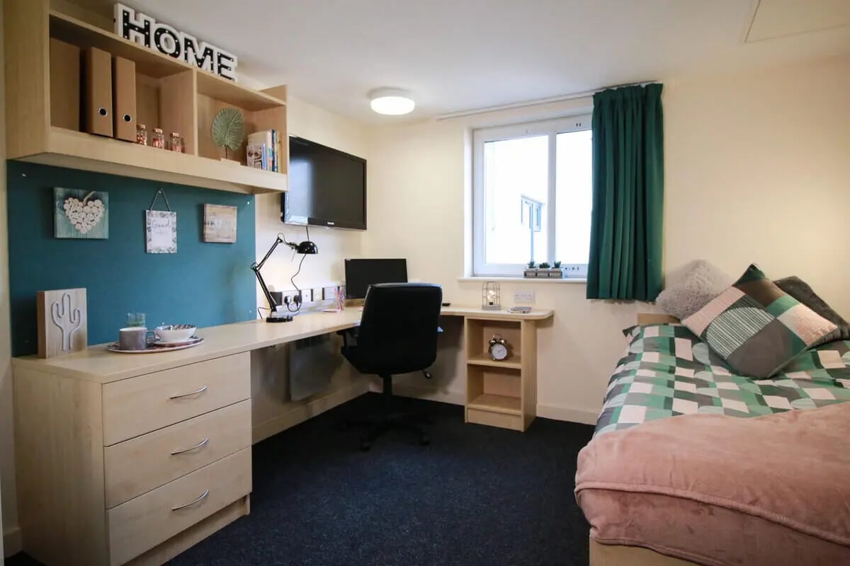 Bed desk shelves TV and window bedroom at The Cube - Loughborough in Loughborough Student Accommodation