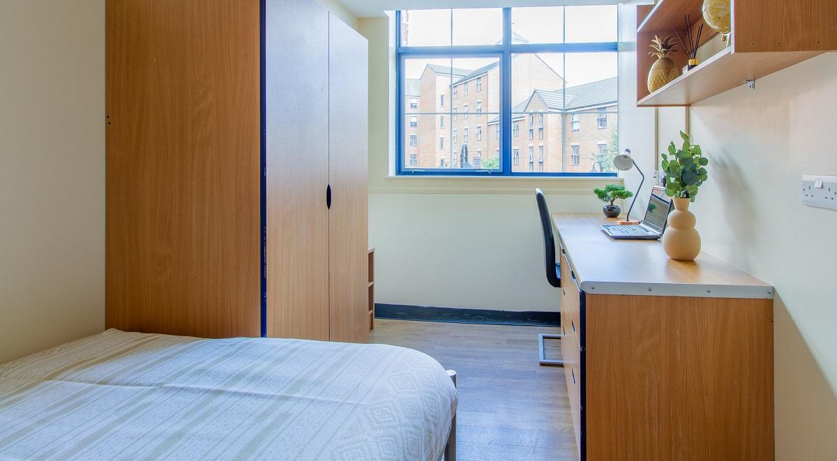 Wardrobe bed desk with laptop study area at Ben Russell Court in Leicester Student Accommodation