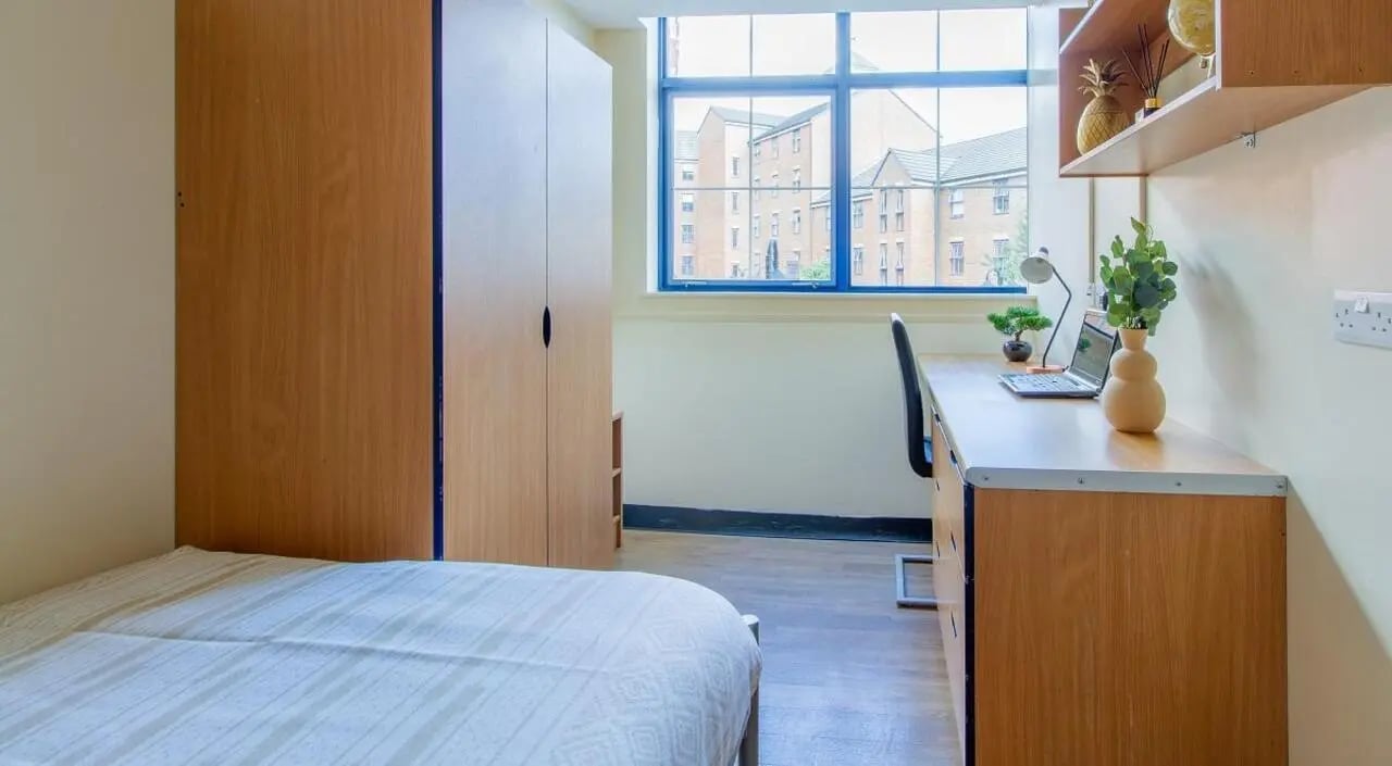 Wardrobe bed desk with laptop study area at Ben Russell Court in Leicester Student Accommodation