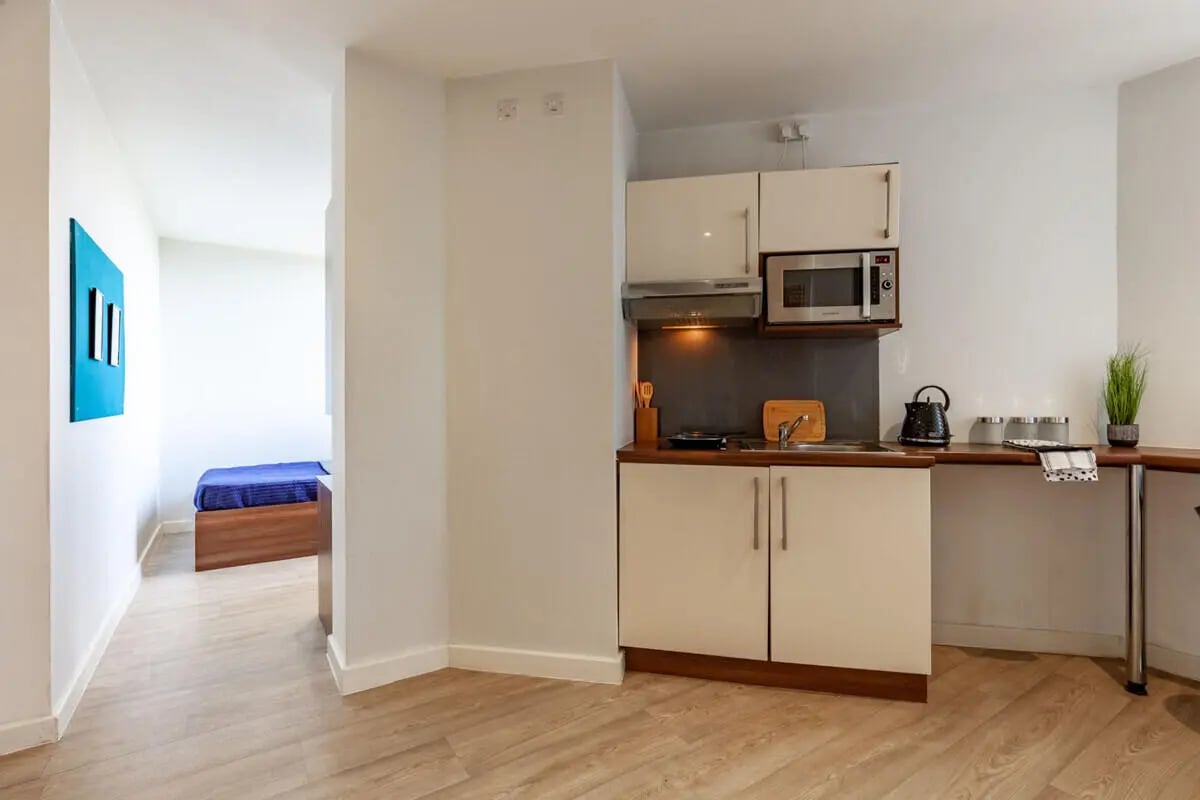 Kitchenette with microwave kettle and bed bedroom at Central Studios - London in London Student Accommodation
