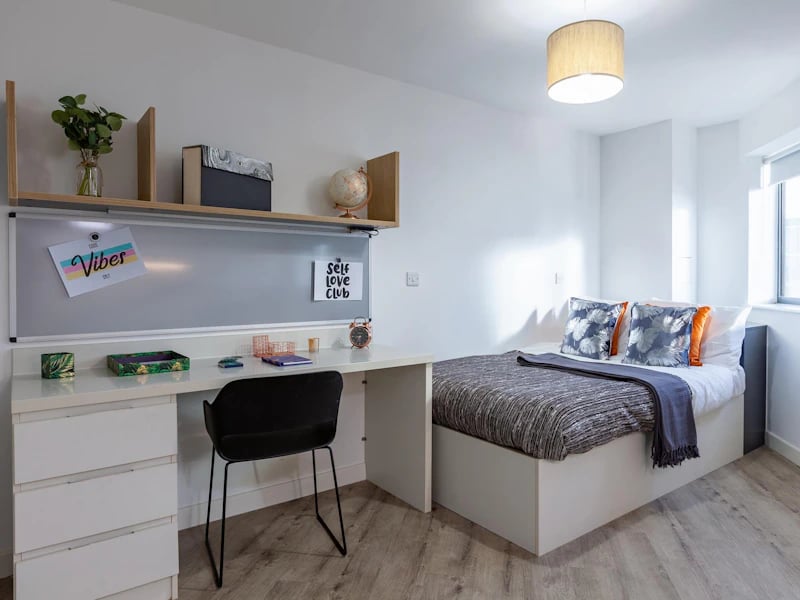 Desk bed whiteboard globe and chair bedroom at The Fitzalan in Cardiff Student Accommodation