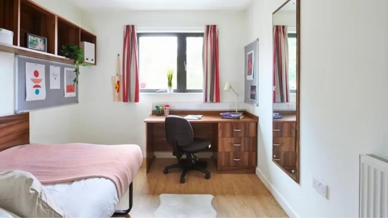 Bed desk chair mirror and shelves student bedroom at The Printworks in Exeter Student Accommodation