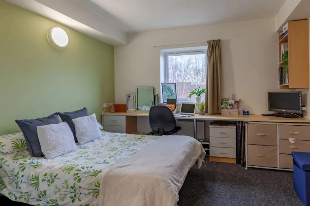 Bed desk chair computer window and shelf bedroom at Leighton Hall in Preston Student Accommodation