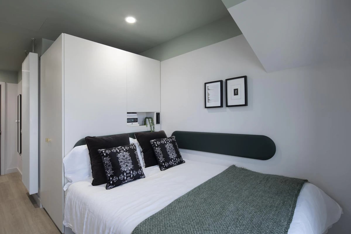 Bed pillows pictures artwork and storage bedroom at The Keel Houses in Edinburgh Student Accommodation