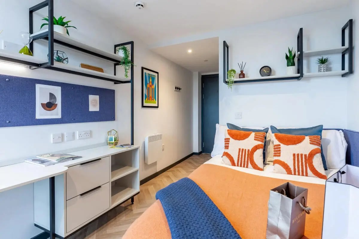 Bed desk shelves and pillows bedroom at Limelight in Liverpool Student Accommodation