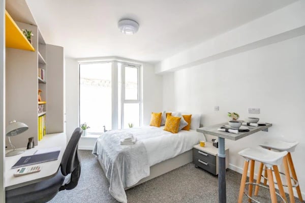 Bed desk and dining area bedroom at Foundry Studios in Lancaster Student Accommodation