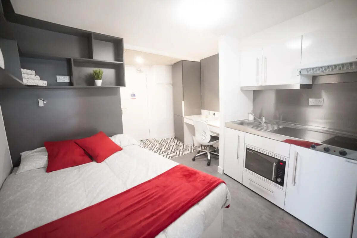 Bed study area kitchen student room at AXO Paradise Student Village in Coventry Student Accommodation
