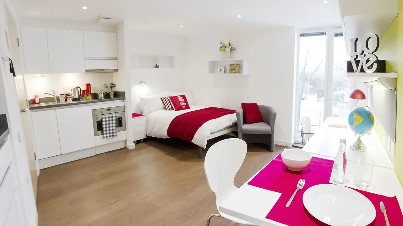 Kitchen bed desk chair and globe room at Griffon Studios in London Student Accommodation