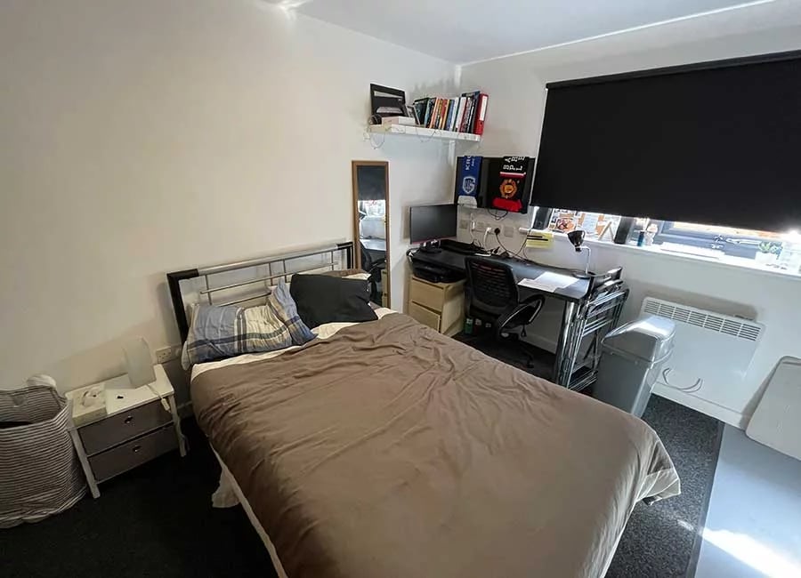 Bed desk and storage units bedroom at Forest Court in Loughborough Student Accommodation