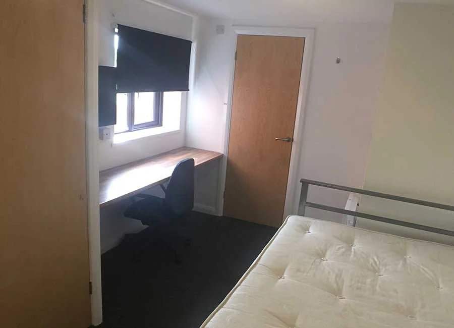 Desk chair window bed door bedroom at Kingfisher Halls in Loughborough Student Accommodation