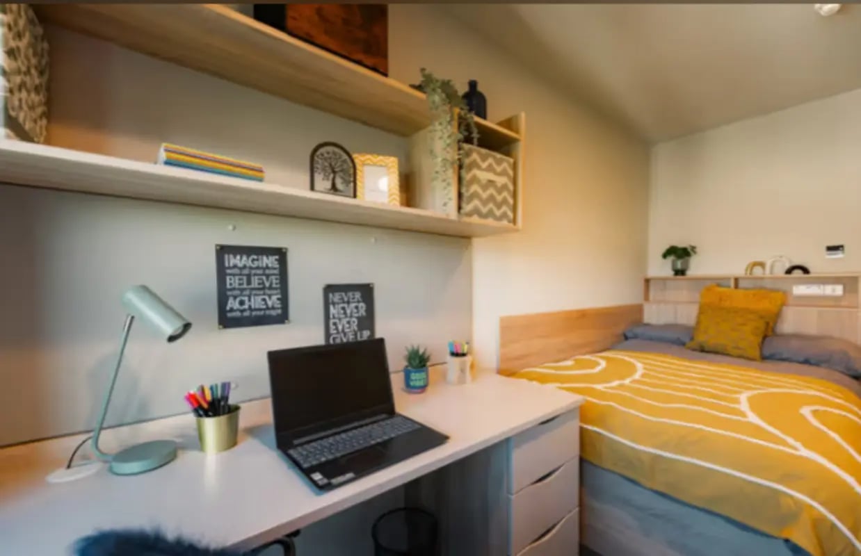 Bed desk lamp laptop motivational posters bedroom at Redgate in Nottingham Student Accommodation