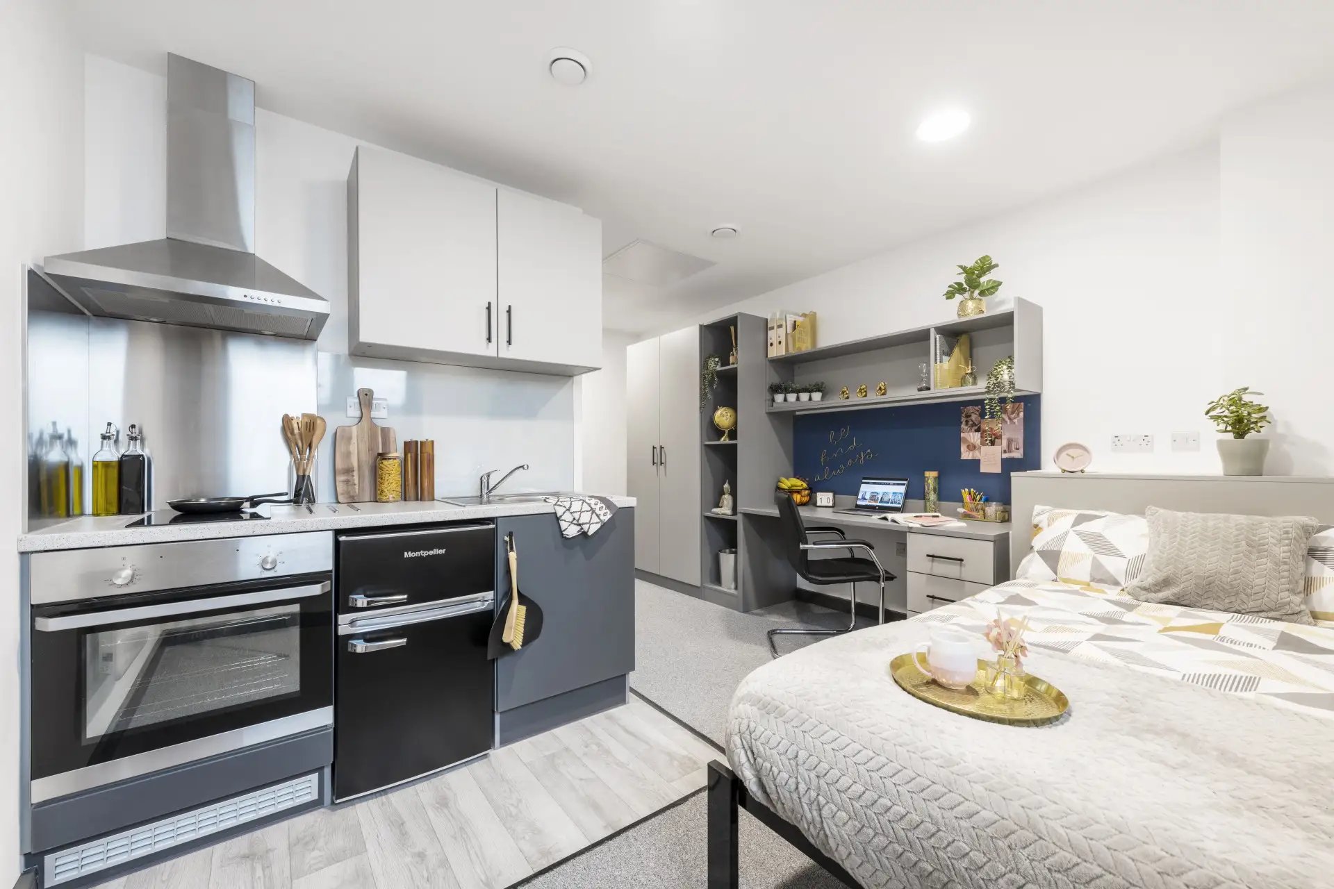 Kitchen bed desk and shelves studio apartment at Compass in Birmingham Student Accommodation
