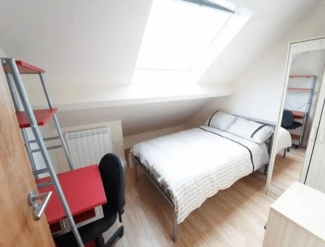 Bed desk chair radiator storage shelf bedroom at dwell Castle Gate Haus in Nottingham Student Accommodation