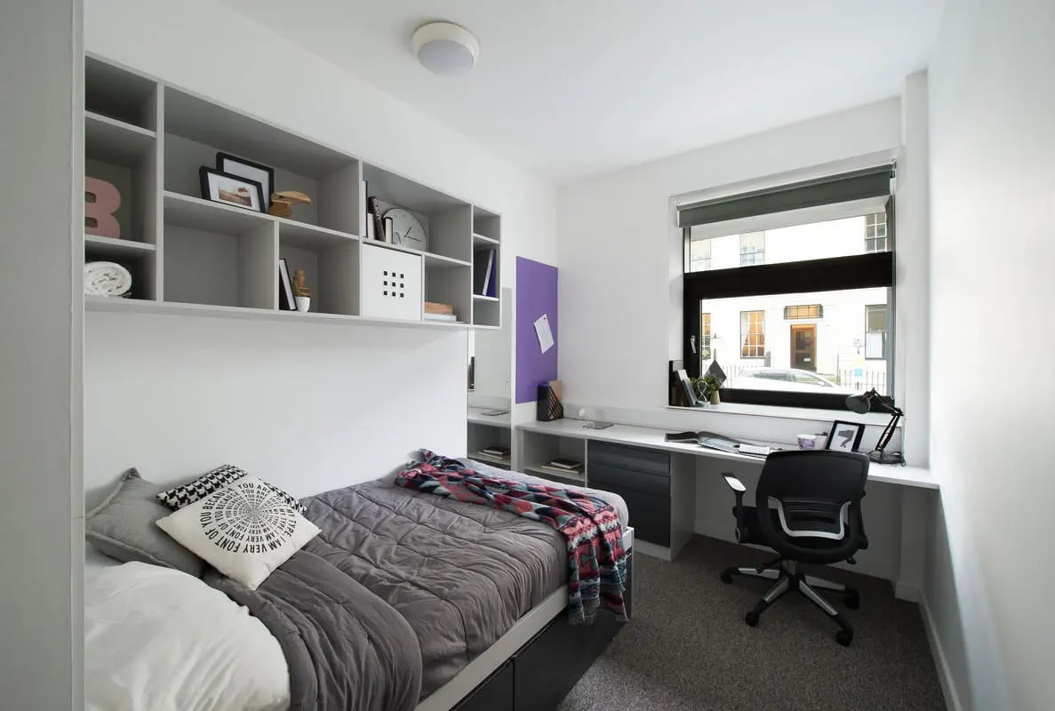 Bed shelves desk chair window Bedroom at Clifton & Stewart House in Glasgow Student Accommodation