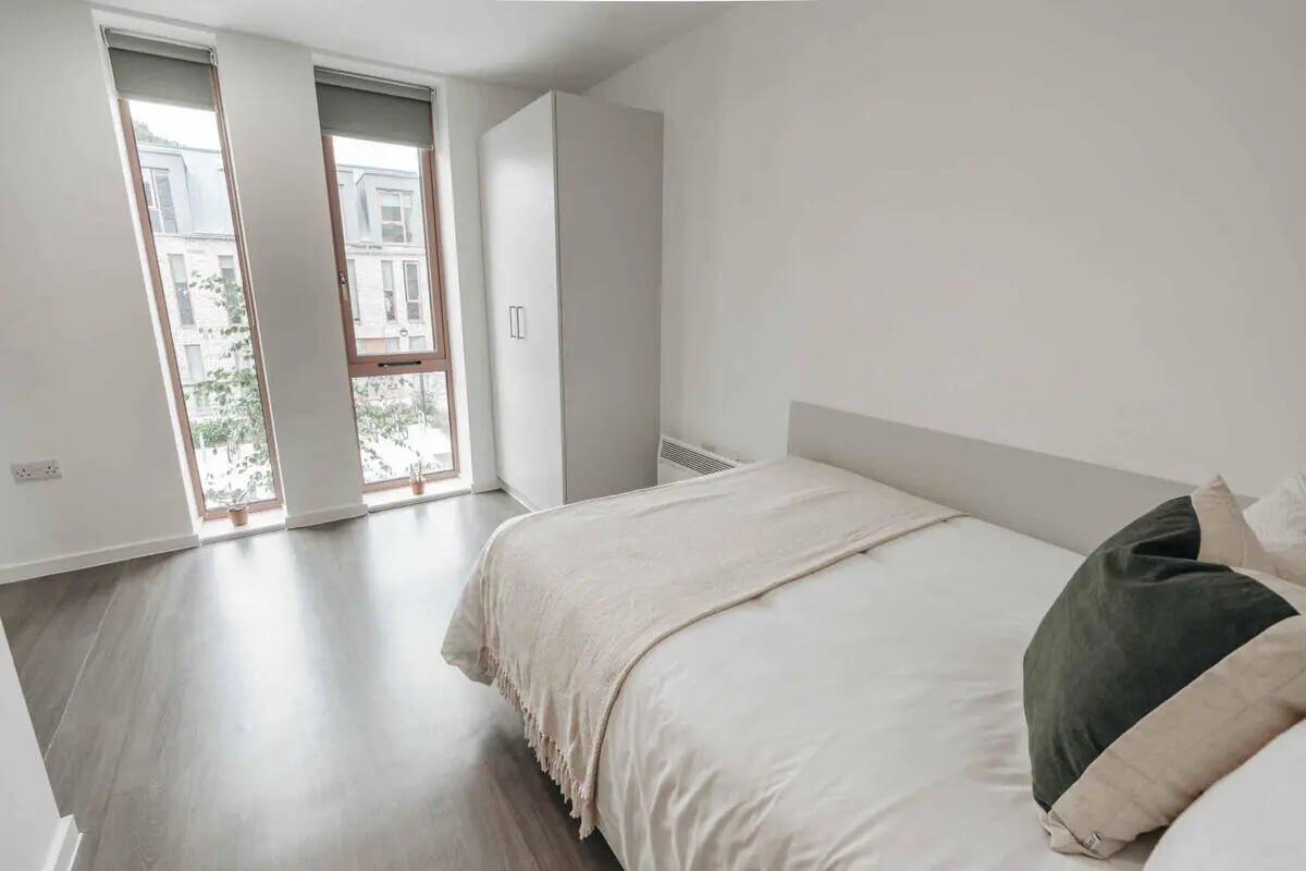 Bed wardrobe and windows bedroom at Alma Court in Canterbury Student Accommodation