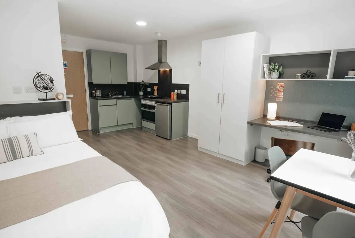 Bed kitchen study area wardrobe and desk interior at Alma Court in Canterbury Student Accommodation