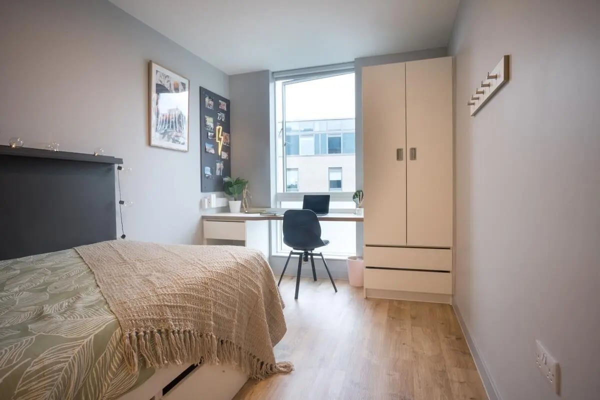 Bed desk wardrobe and window bedroom at West Wing in Cardiff Student Accommodation