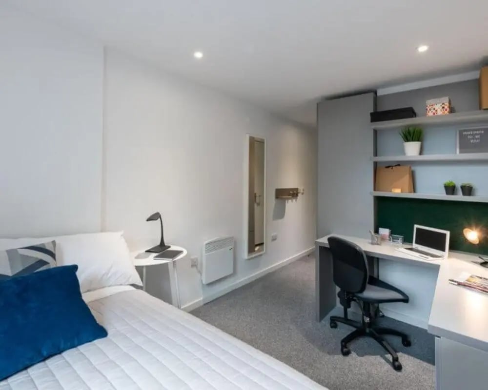 Bed desk chair laptop shelves bedroom at Verde in Newcastle Upon Tyne Student Accommodation
