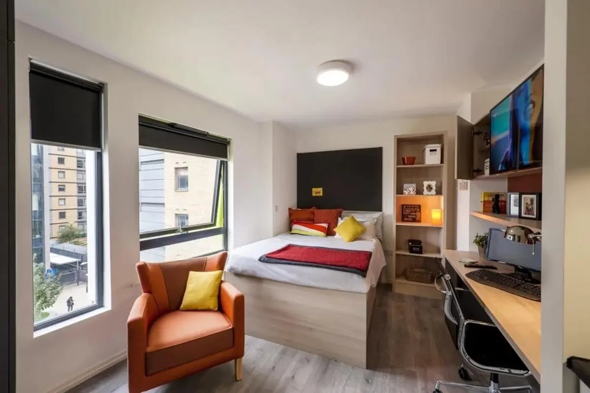 Bed desk chair bookshelf television bedroom at The Lyra in London Student Accommodation
