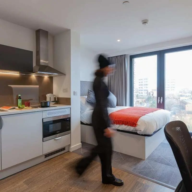 Kitchenette with bed and large window bedroom at True Glasgow in Glasgow Student Accommodation