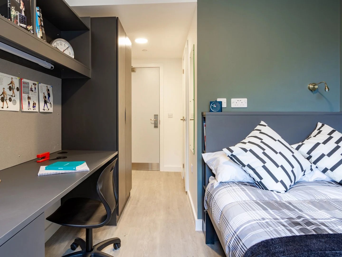 Desk bed and hallway student accommodation bedroom at Benedict's Gate in Norwich Student Accommodation