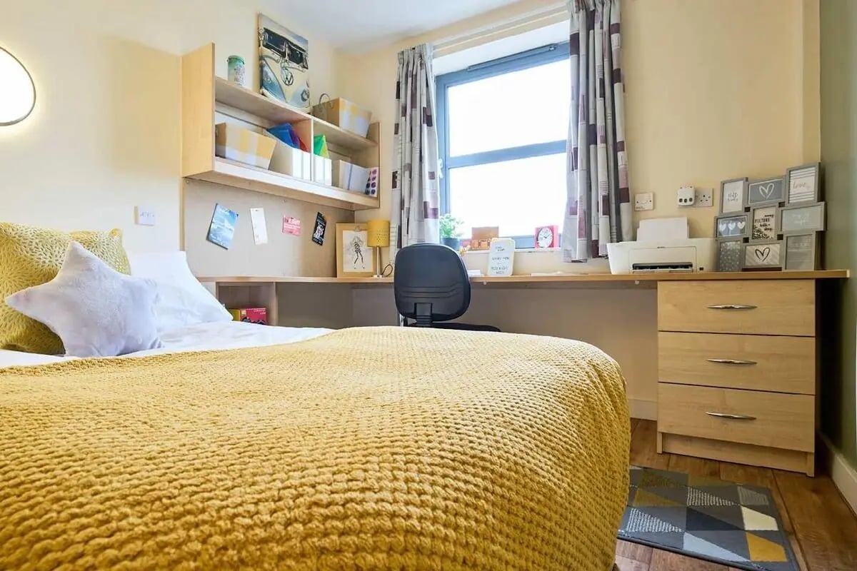 Bed desk printer shelves and window bedroom at Europa in Liverpool Student Accommodation