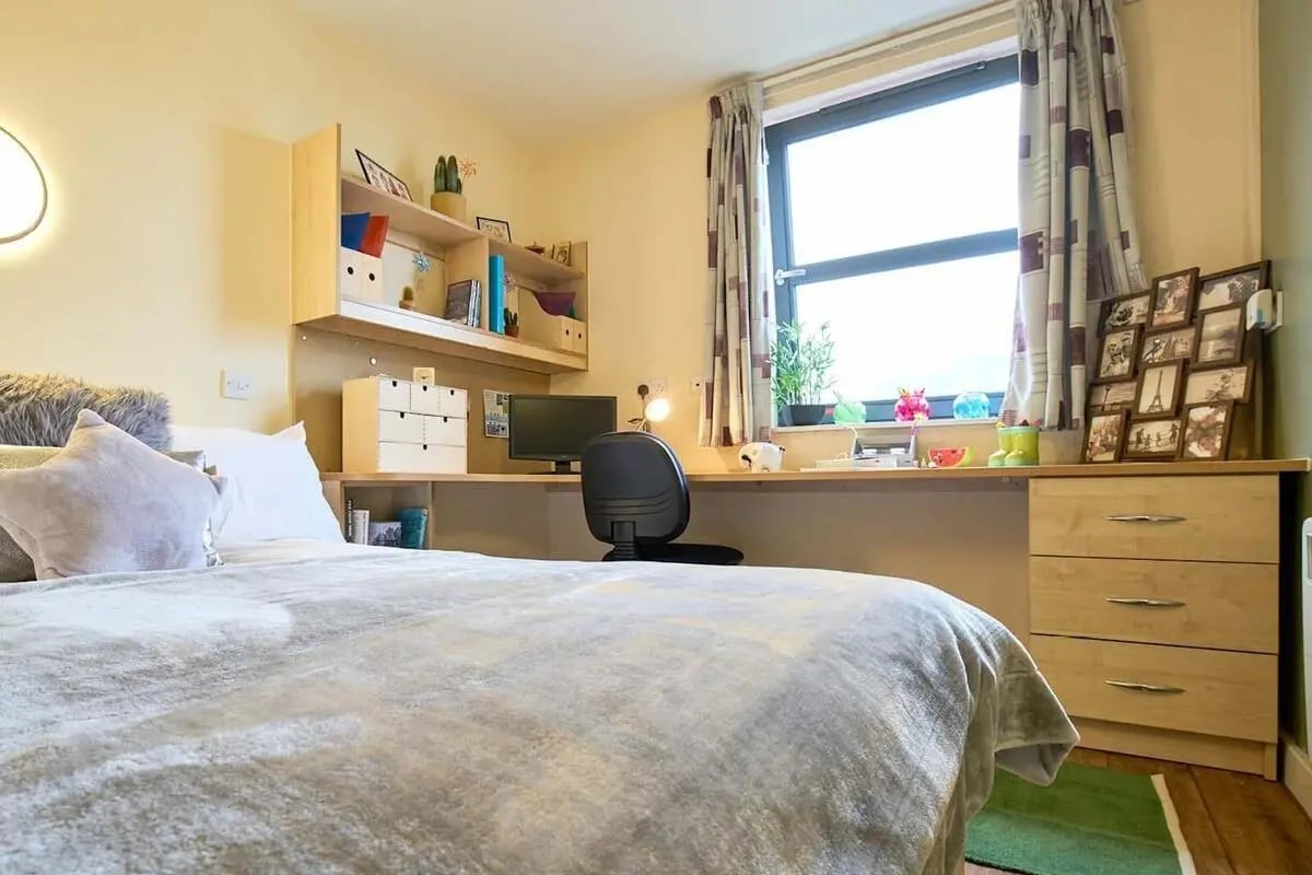 Bed desk shelves and computer Bedroom study area at Europa in Liverpool Student Accommodation