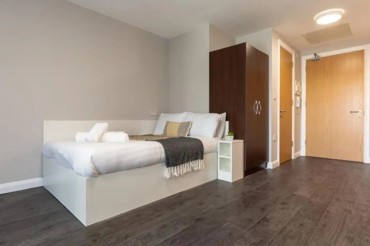 Bed wardrobe bedside table and doors bedroom at One Islington Plaza in Liverpool Student Accommodation
