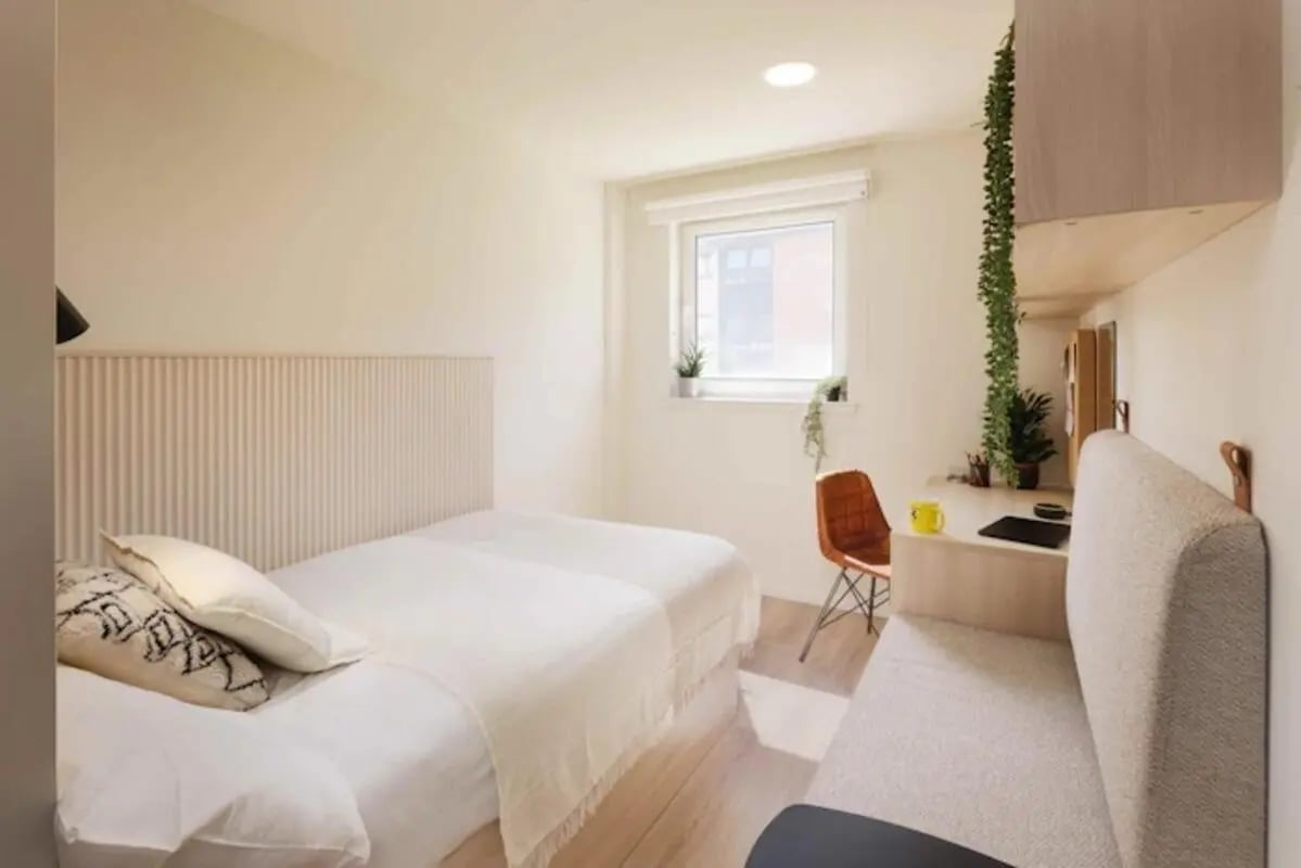 Bed desk chair and sofa bedroom at Buchanan View in Glasgow Student Accommodation