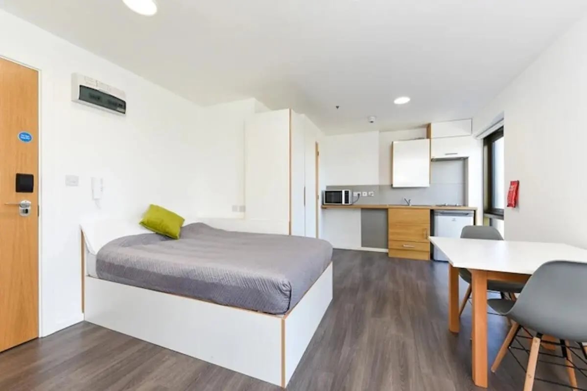 Bed kitchen dining area and table Living room at Byrom Point in Liverpool Student Accommodation