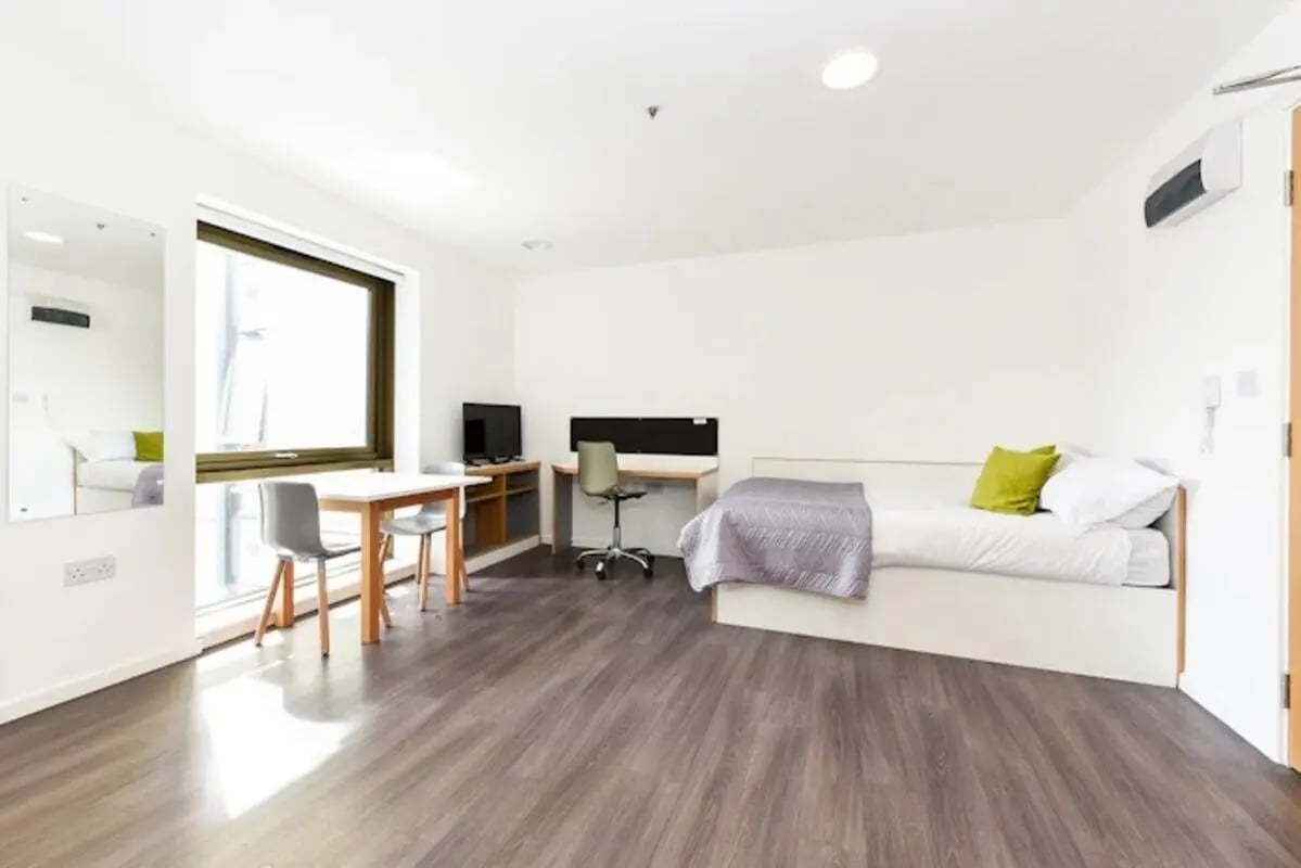 Bed desk chair table mirror bedroom study area at Byrom Point in Liverpool Student Accommodation