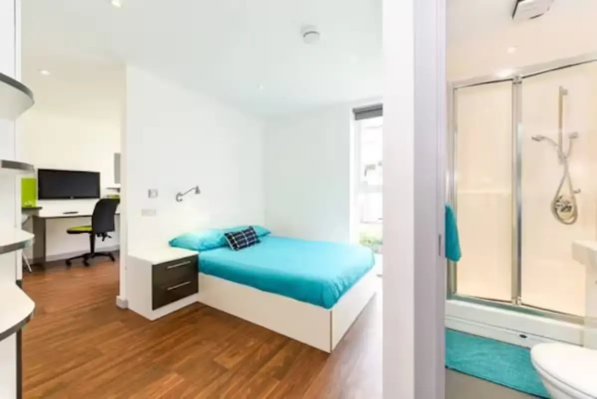 Bed desk shower and toilet bedroom and bathroom at The Boulevard in York Student Accommodation
