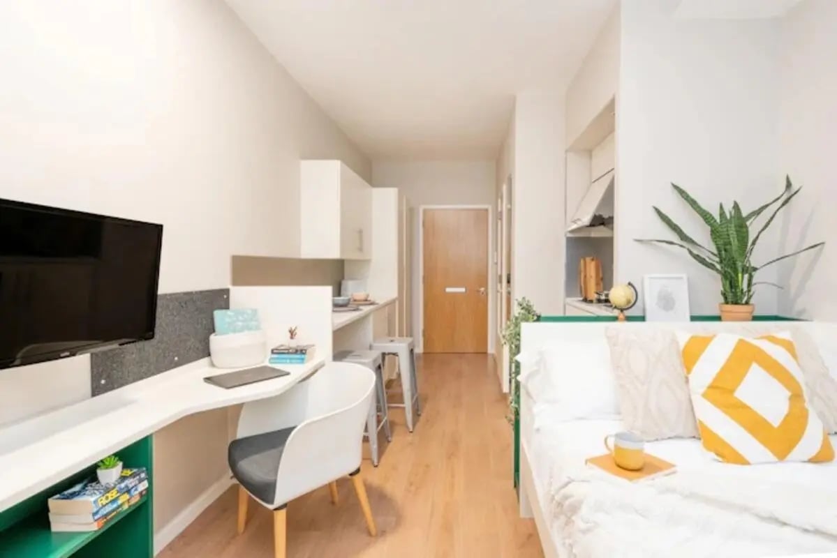 Desk TV kitchen and bed studio apartment at The Depot in Bath Student Accommodation
