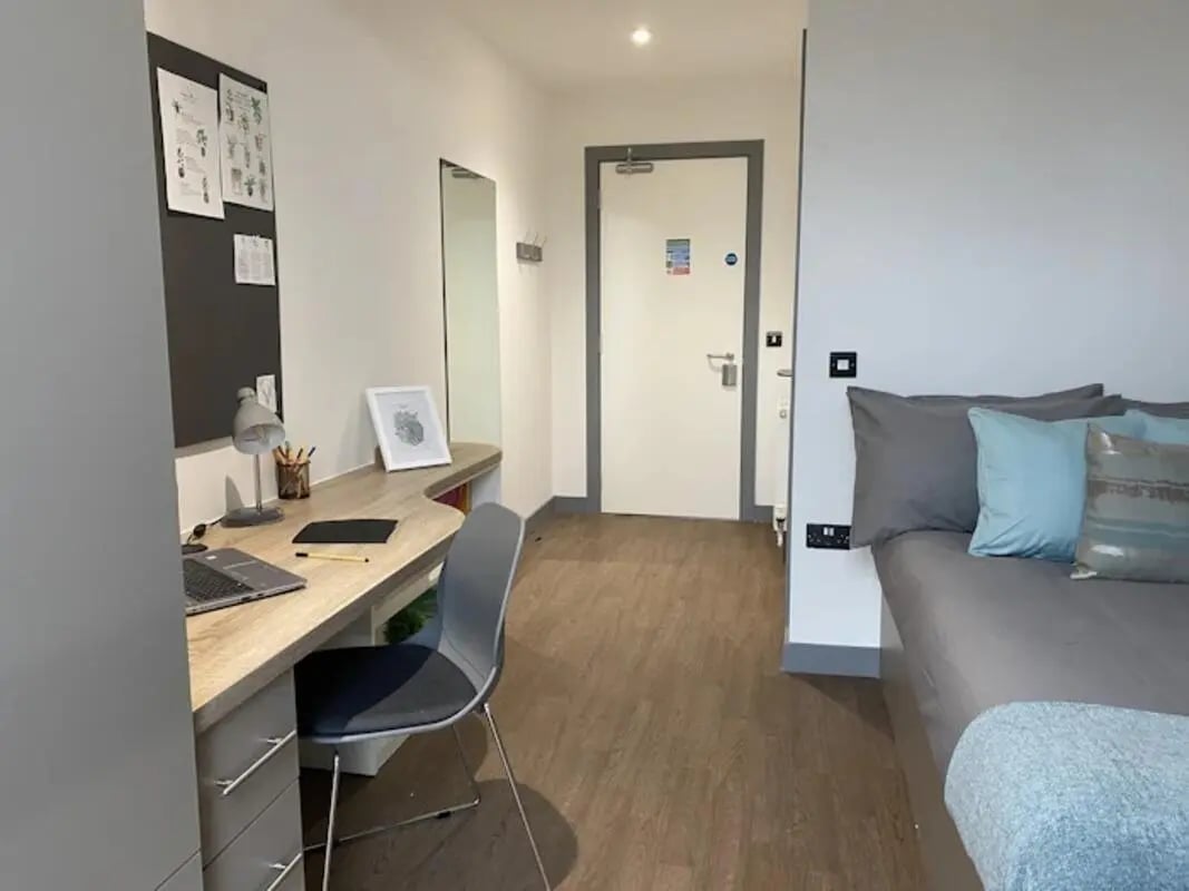 Desk chair laptop mirror and bed bedroom at Great Patrick Street in Belfast Student Accommodation
