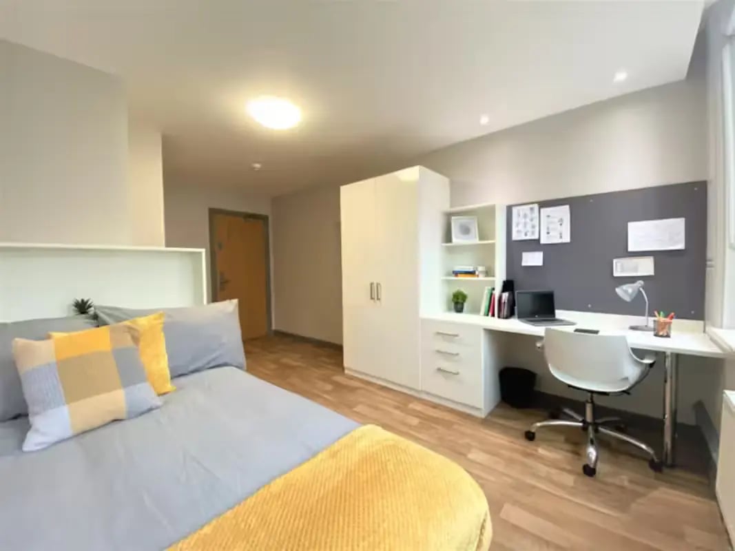 Bed desk wardrobe and shelves bedroom at John Bell House in Belfast Student Accommodation