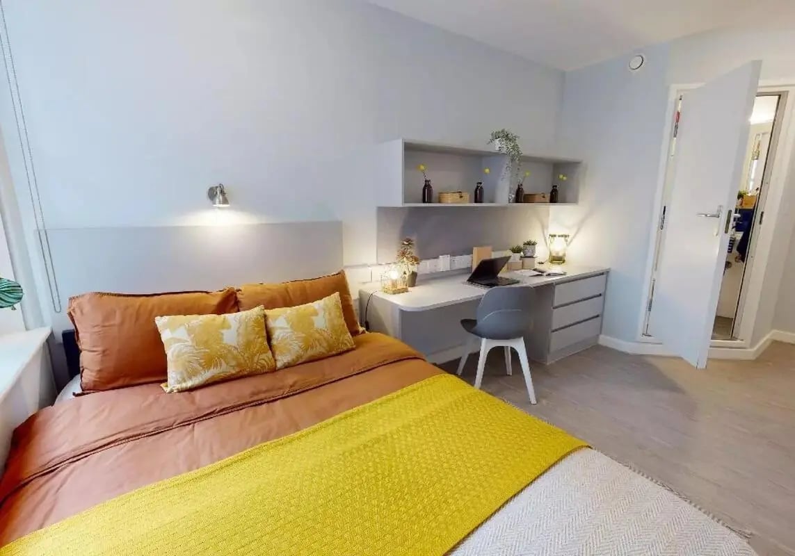 Bed desk chair laptop shelving with decor bedroom at iQ Tufnell House in London Student Accommodation