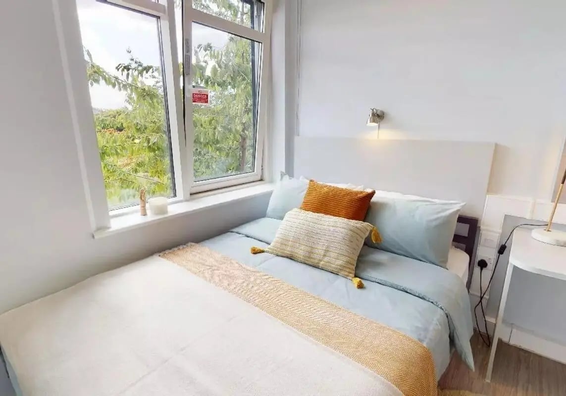 Bed with pillows and throw bedroom at iQ Tufnell House in London Student Accommodation
