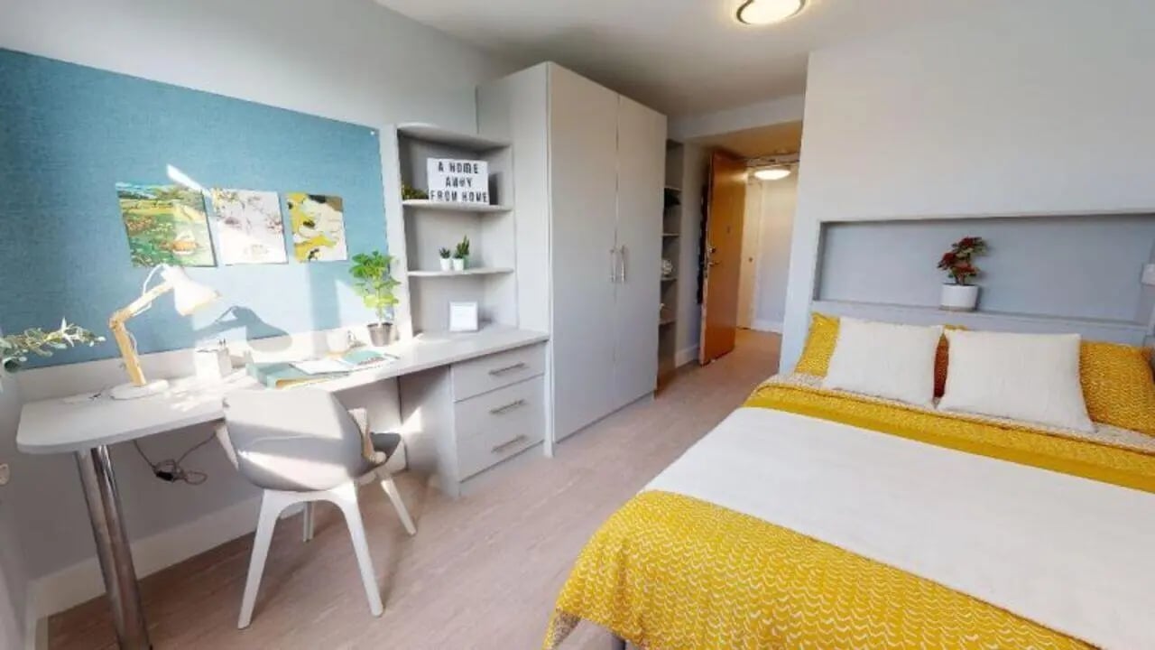 Desk chair artwork and bed student bedroom at iQ Hoxton in London Student Accommodation