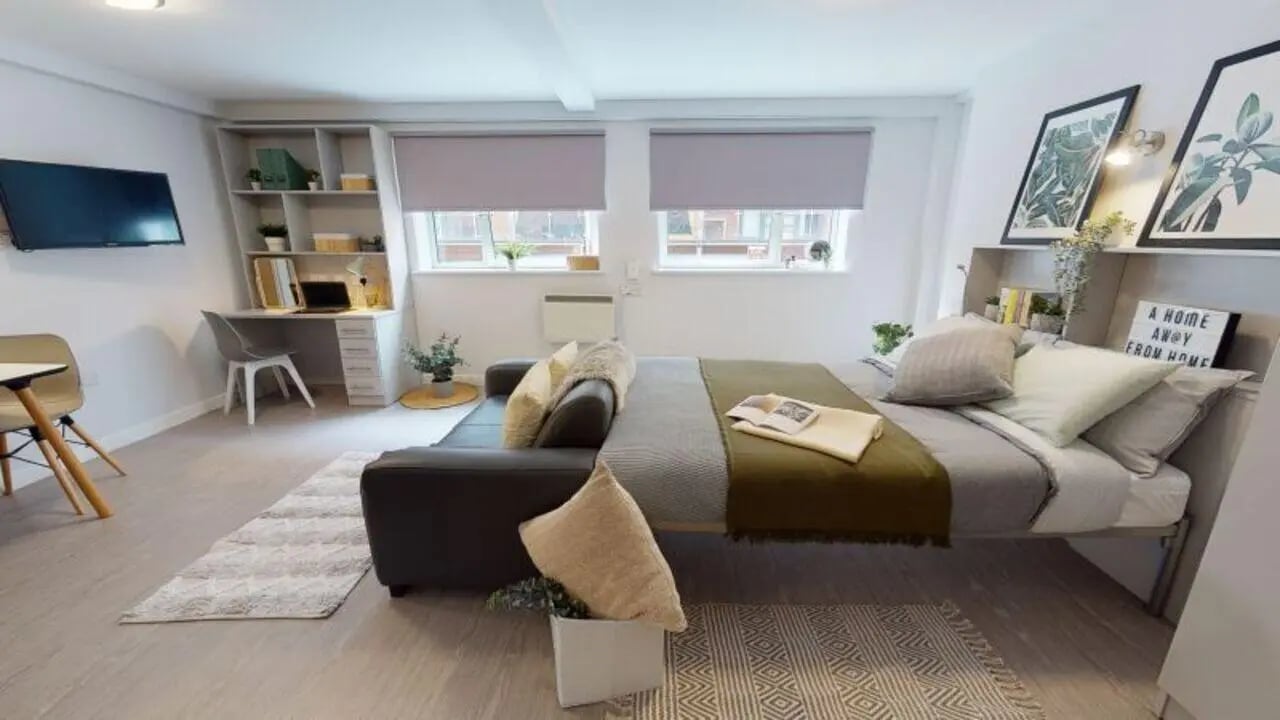 Bed desk TV sofa and shelves student studio at iQ Fenton House in Sheffield Student Accommodation