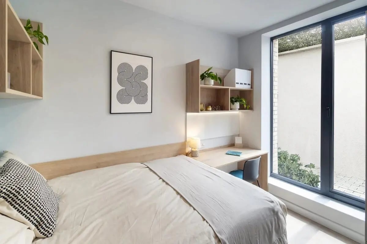 Bed desk shelves artwork window bedroom at Stoneybatter Place in Dublin Student Accommodation