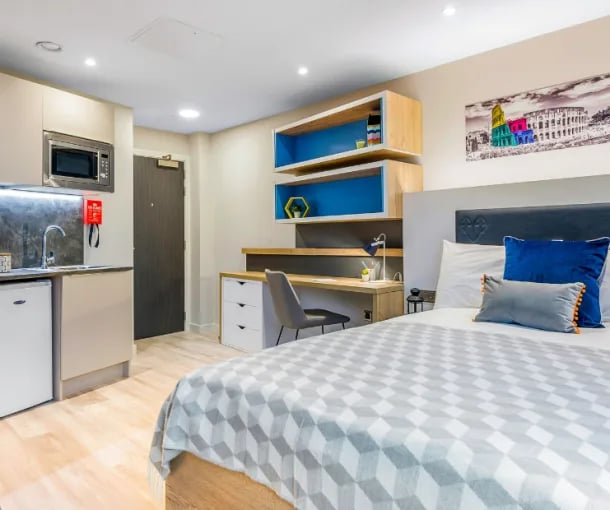 Bed kitchen desk and shelves student studio. at Gravity in Lincoln Student Accommodation