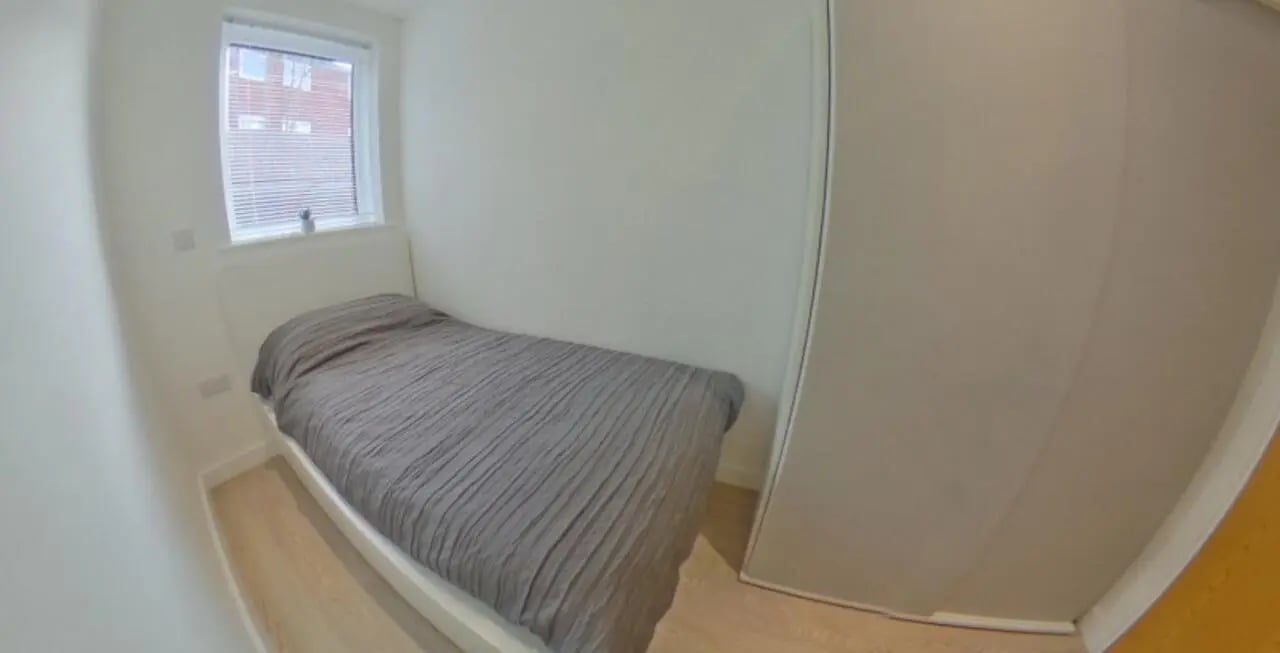 Bed wardrobe window bedroom at Orme House in Newcastle Under Lyme Student Accommodation